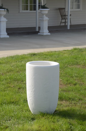 The Faraway Garden Cypress Urn is a tall, statement planter with a unique textured treatment on exterior.  This impressive garden planter looks stunning as part of a group; or as a focal point at the end of a walkway or as a pair flanking an entrance. An ideal planter for ornamental trees.