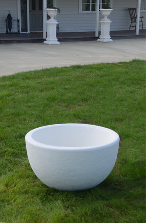 The Faraway Garden Willow Urn is a large, elegant planter, with a half sphere shape and a unique textured treatment on exterior.    This impressive garden planter looks stunning as part of a group; or as a focal point at the end of a walkway or as a pair flanking an entrance. An ideal planter for ornamental trees.