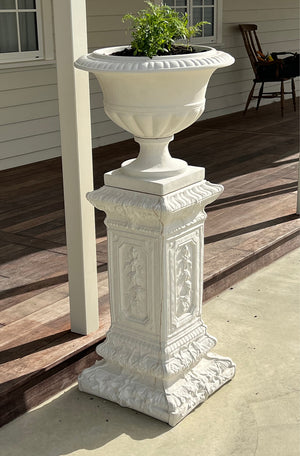 The Faraway Garden Laurent Pedestal is impressively elegant with fielded panelling combined with classical botanical detailing to the shaft, and strong linear moulding with further plant themes at base and top. This tall pedestal partners perfectly with many of our planters, urns and unique objects for the garden.