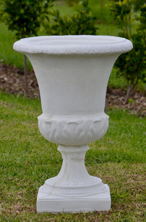 The Faraway Garden Italian Vase is a timelessly elegant garden planter inspired by the classical ancient Greek aesthetic. It features gadrooning on the bowl and egg and dart moulding around rim.  These garden planters are ideal as a pair placed on one of our Faraway Garden pedestals where they become the perfect statement focal point to a terrace, walkway or entrance.