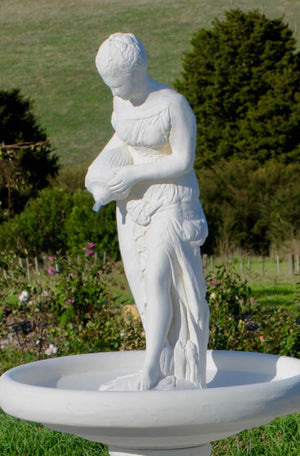 The Faraway Garden Water Carrier is a graceful garden statue or water feature depicting a classical character of Greek antiquity. She works wonderfully as a statue raised on a pedestal in a formal flower bed, a rose garden or nestled in an herbaceous border.  As a water feature she looks delightful in a circular garden pond or as a fountain (see our Water Carrier Fountain).