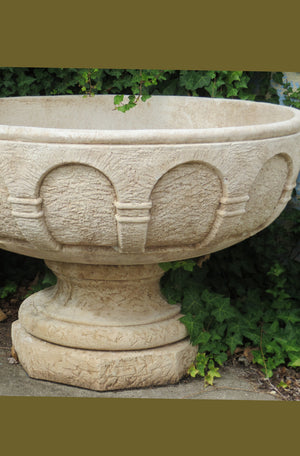 The Faraway Garden Abbey Planter is a large, beautifully proportioned planter on a pedestal. This impressive planter has distinctive indented moulding around the bowl. It works wonderfully on a lawn, in a rose garden or nestled in an herbaceous border. It makes a great focal point in a formal flower bed or raised on a plinth at the end of a green hedge walk.