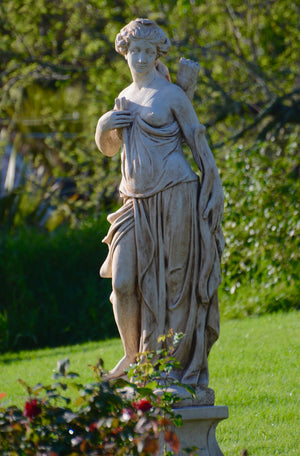 The Faraway Garden Diana is a tall, graceful garden statue depicting the Roman goddess of the hunt; and also associated with nature and fertility. This impressive statue works wonderfully as a focal point when raised on a pedestal in a formal flower bed, circular water feature or at the end of a green hedge walk. She looks wonderful hand washed in sepia for an aged effect.