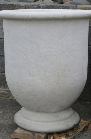 The Faraway Garden Modenza Urn - Grand is a large, elegant garden planter inspired by the classical Italian aesthetic with a generous rolled rim.  This impressive garden planter looks stunning as part of a group or row; or as a focal point at the end of a walkway or as a pair flanking an entrance. An ideal planter for ornamental trees.