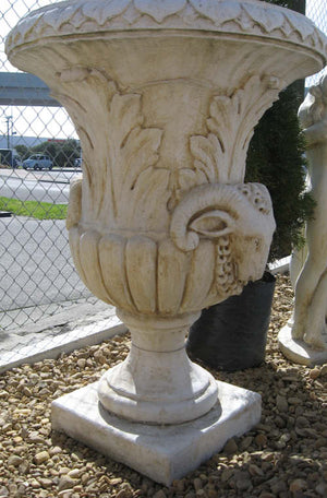 The Faraway Garden Ovid Urn is a large, elegant garden planter inspired by the classical Greek aesthetic with elaborate leaf moulding on the rim and around bowl. The detailed goat motif symbolises abundance, determination, health and vitality. This urn looks wonderful in a sepia wash for an instant aged effect.  This unique garden planter would look stunning as part of a group or positioned on a Faraway Garden pedestal and the focal point at the end of pathway or the centrepiece of a rose garden.