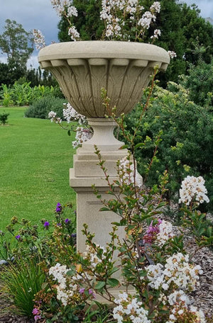 The Faraway Garden Esme Urn is a large, elegant garden planter inspired by the classical aesthetic of Ancient Greece with its distinctive moulding on the rim and formal leaf design around bowl.   This unique garden planter would look gorgeous as part of a group or positioned on a Faraway Garden pedestal and the focal point at the end of pathway or the centrepiece of a rose garden. Pictured on our Mansfield Pedestal - Large in Ivory, combined the pieces are 1.5m high.