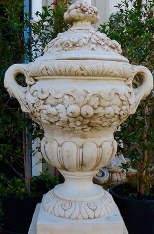 The Faraway Garden Chateau Planter is a large, beautifully proportioned planter with handles and also has the option of an ornate cap (additional $180). This impressive planter has elaborate moulding around the bowl and on the rim . It works wonderfully on a lawn, in a rose garden or nestled in an herbaceous border. It makes a great focal point in a formal flower bed or raised on a plinth at the end of a green hedge walk.