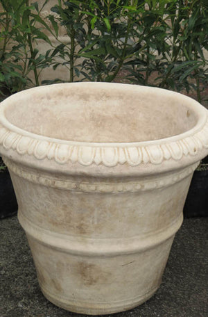 The Faraway Garden Roman Pot is a large, elegant garden planter inspired by the classical Italian aesthetic with distinctive linear moulding around bowl and egg and dart pattern on rim.